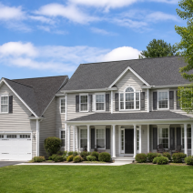 Roof replacement in Loudoun County VA: new architectural shingles on a suburban home