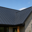 Standing seam metal roof cost: modern gray metal roof with concealed fasteners